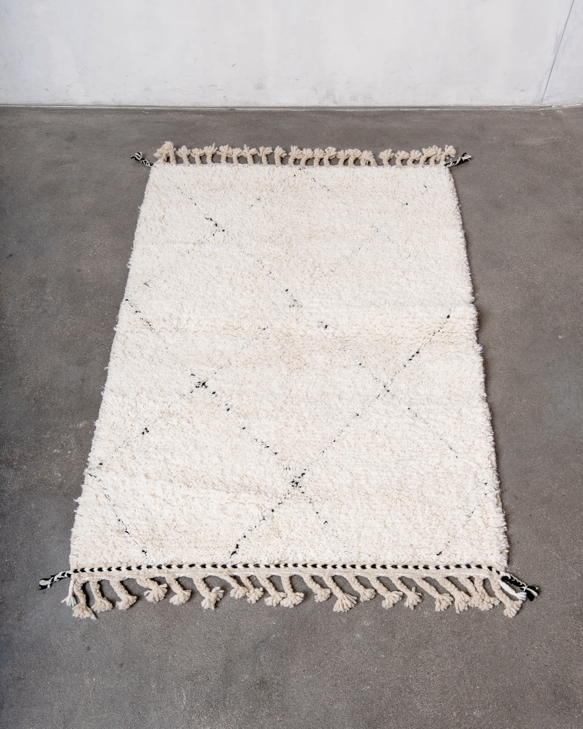 Modern, designer, handcrafted Berber rug from Morocco. Beniourain carpet with minimalist design, natural wool pile and a fluffy texture.